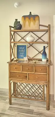 a wooden dresser with vases on top of it at Aqua 1703 in Panama City Beach