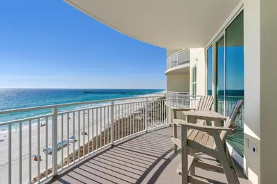 a balcony with a chair and the ocean at Aqua 0708 in Panama City Beach