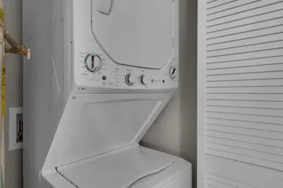 a white refrigerator with its door open in a kitchen at Aqua 0611 in Panama City Beach