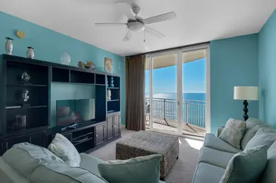 a living room with a view of the ocean at Aqua 1708 in Panama City Beach
