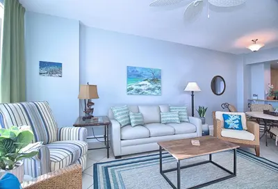 a living room with a couch and chairs at Aqua 1510 in Panama City Beach