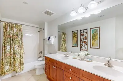 a bathroom with a sink and a toilet at Aqua 1001 in Panama City Beach