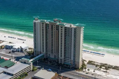 an aerial view of a large building next to the beach at Aqua 2211 in Panama City Beach