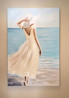 a painting of a woman walking on the beach at Aqua 1409 in Panama City Beach