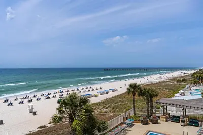 a beach with a lot of people and the ocean at Aqua 0307 in Panama City Beach
