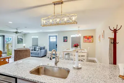a kitchen and living room with a sink at 1 Mi to Beach Dog-Friendly PCB Home with Backyard! in Panama City Beach
