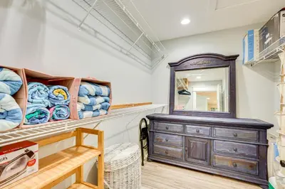 a dressing room with a dresser and a mirror at 1 Mi to Beach Dog-Friendly PCB Home with Backyard! in Panama City Beach
