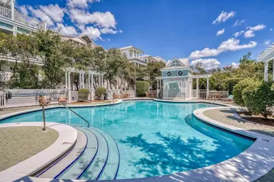 a swimming pool at a villa with a mansion at Inlet Breeze in Inlet Beach