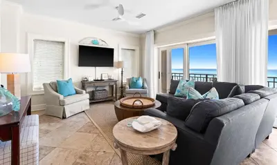 a living room with a couch and a table at Five Star in Inlet Beach