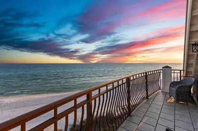a view of the ocean from the balcony of a house at Five Star in Inlet Beach