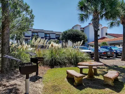 a park with a picnic table and a grill at Dune Villas 6A in Santa Rosa Beach