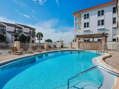 a large swimming pool in front of a building at Dune Villas 6A in Santa Rosa Beach