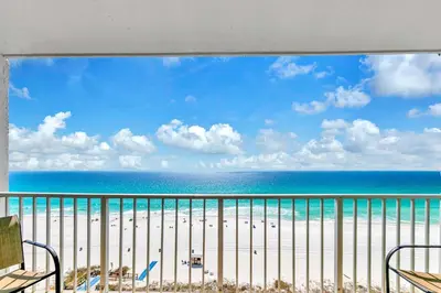 a view of the beach from a balcony at The Summit 1209 in Panama City Beach