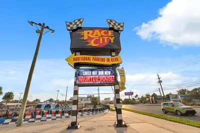 a large sign for a race city restaurant on a street at Treasure Island Unit 2011: Sunset Sands, 2 Bed/2 Bath Retreat – Sleeps 8! in Panama City Beach