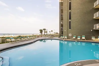 a large swimming pool in a hotel with the beach at Panama City Condo Rental Studio with Private Beach Access in Panama City Beach