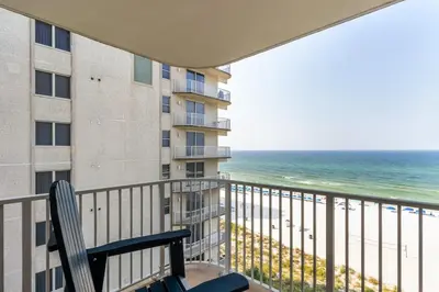a balcony with a view of the ocean at Panama City Condo Rental Studio with Private Beach Access in Panama City Beach