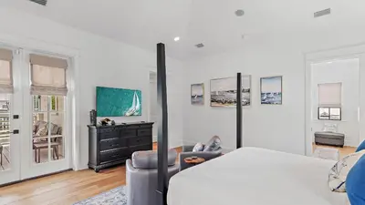 a white bedroom with a bed and a dresser at Beach Sea-kers Retreat by AvantStay Rooftop Deck w Views Pool Luxury 5BDR in Inlet Beach