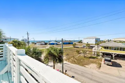 a view of a street from a balcony of a building at Beach House - Sunset Paradise by Panhandle Getaways in Panama City Beach