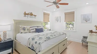 a bedroom with a bed and a ceiling fan at Resorting To Happiness by AvantStay Close to the Beach w Pool Access in Inlet Beach