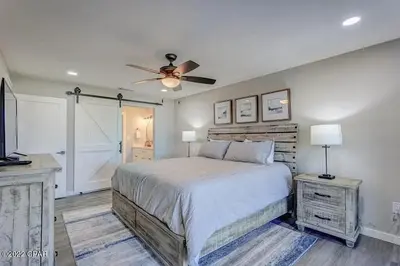 a bedroom with a bed and a ceiling fan at Edgewater Beach Resort Dream Villa! One Bedroom in Panama City Beach