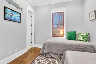 a bedroom with a bed and a window at Narnia Grande Pointe Villa - Inlet Beach Pool & Clubhouse Access in Inlet Beach