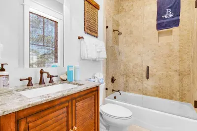 a bathroom with a sink and a toilet and a tub at Narnia Grande Pointe Villa - Inlet Beach Pool & Clubhouse Access in Inlet Beach