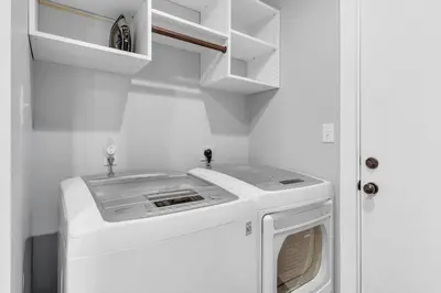 a washer and dryer in a small kitchen at Narnia Grande Pointe Villa - Inlet Beach Pool & Clubhouse Access in Inlet Beach