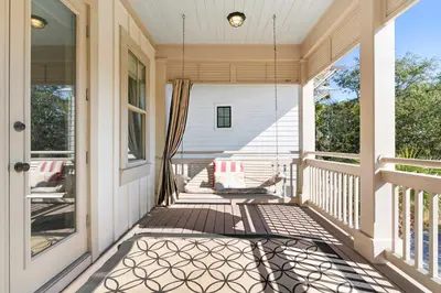 a front porch of a white house with a window at Narnia Grande Pointe Villa - Inlet Beach Pool & Clubhouse Access in Inlet Beach