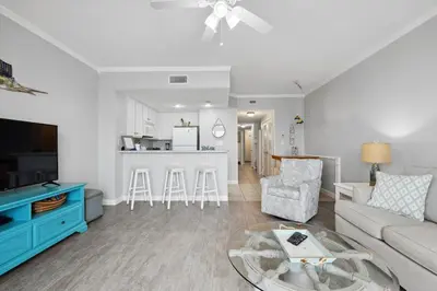 a living room with a couch and a table at Seychelles 1406 Free Beach Chairs in Panama City Beach