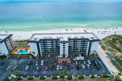 an aerial view of a hotel with the beach at Edgewater Windward 508 - Newly Renovated Corner Condominium! in Panama City Beach