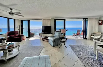 a living room with a view of the ocean at Watercrest 1403 - Stunning Ocean Overlook in Panama City Beach