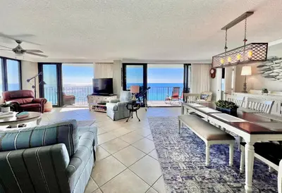 a living room with a view of the ocean at Watercrest 1403 - Stunning Ocean Overlook in Panama City Beach