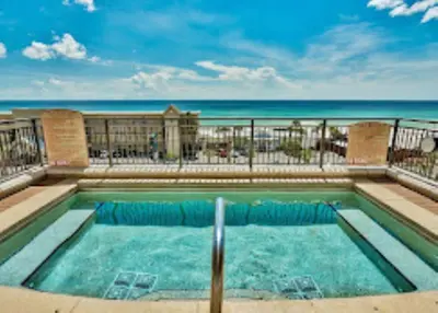 a swimming pool with the beach in the background at Origin Unit 911 in Panama City Beach