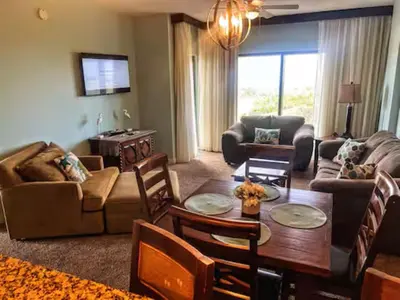 a living room with a couch and a table at Origin Unit 911 in Panama City Beach