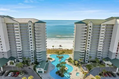 an aerial view of a resort with the beach at Coastal Hideaway: Cozy Beachfront Studio – Sleeps 4 with Stunning Views! in Panama City Beach