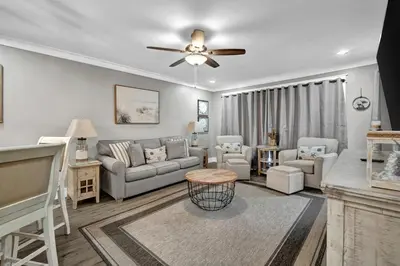 a living room with a couch and chairs at Edgewater Beach Resort stay at Cozy Beach Getaway! in Panama City Beach