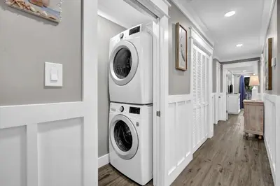 a laundry room with a washer and dryer at Edgewater Beach Resort stay at Cozy Beach Getaway! in Panama City Beach