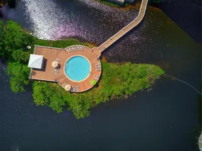 an aerial view of a house on an island in the water at Penthouse at Laketown Wharf in PCB! 2132 in Panama City Beach