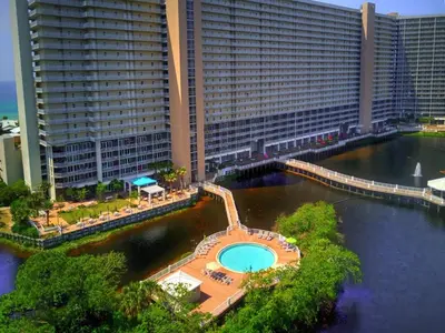 a large building with a swimming pool in the water at Penthouse at Laketown Wharf in PCB! 2132 in Panama City Beach