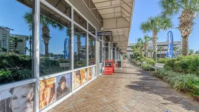 a building with movie posters on the side of it at Penthouse at Laketown Wharf in PCB! 2132 in Panama City Beach
