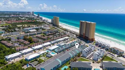 an aerial view of a city and the beach at Paradise found steps to beach in Panama City Beach