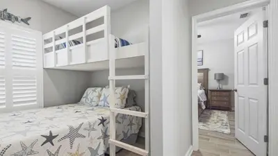 a bedroom with a bunk bed and a bunk bed at PCB 3 Bed 2 Bath house Chasing Sunsets in Panama City Beach