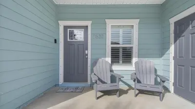 two chairs sitting on the porch of a house at PCB 3 Bed 2 Bath house Chasing Sunsets in Panama City Beach