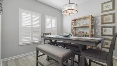 a dining room with a table and chairs at PCB 3 Bed 2 Bath house Chasing Sunsets in Panama City Beach