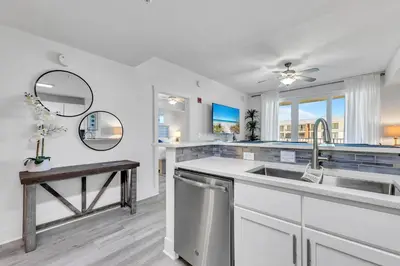 a kitchen with a sink and a counter top at Calypso 3-309 - Gypsea's View in Panama City Beach