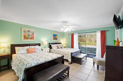 a bedroom with two beds and a window at Edgewater Beach View Villas #3304 in Panama City Beach