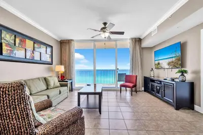a living room with a couch and a table at Tidewater 715 in Panama City Beach