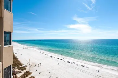 a beach with people on it and the ocean at Tidewater 715 in Panama City Beach