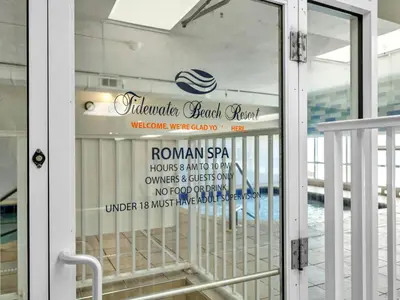 a glass door with a sign on a building at Tidewater 715 in Panama City Beach