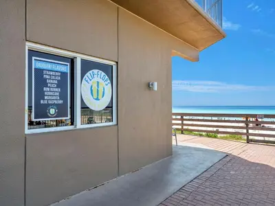 a building with a window with a view of the beach at Tidewater 2903 in Panama City Beach